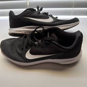 Nike black and white running shoe.